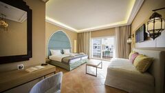 Maximum Golfreisen Webseite mit Robinson Club Agadir. Das Zimmer mit Gartenblick und das Bett