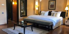 Maximum Golfreisen, Marokko/Agadir, Tikida Golf Palace-das Zimmer mit Möbeln und das Bett