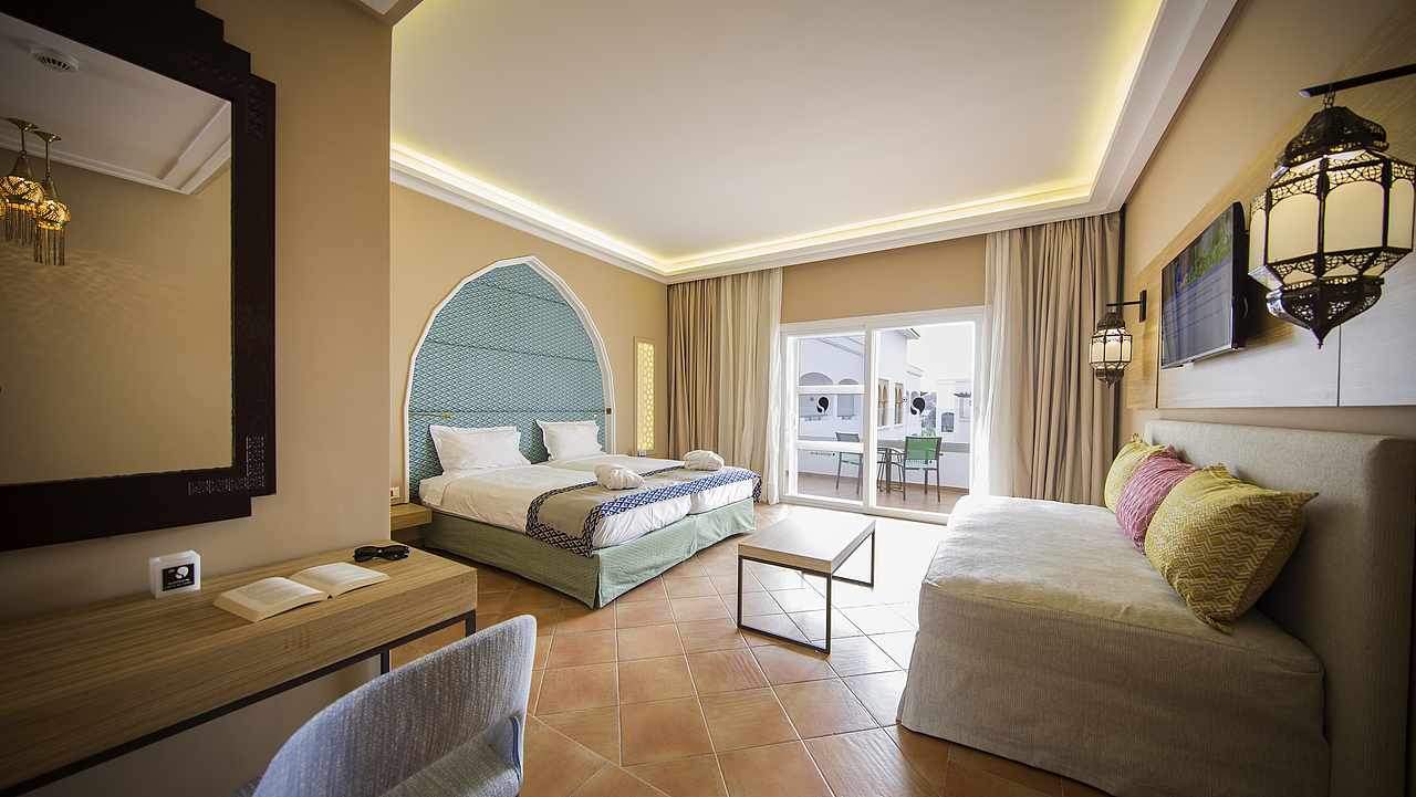 Maximum Golfreisen Webseite mit Robinson Club Agadir. Das Zimmer mit Gartenblick und das Bett